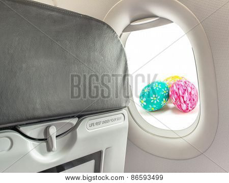 Image Of Easter Egg And  Fasten Seat Belt While Seated Sign On Airplane .