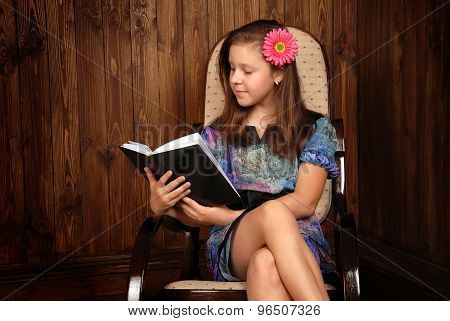 Girl In A Chair With The Book