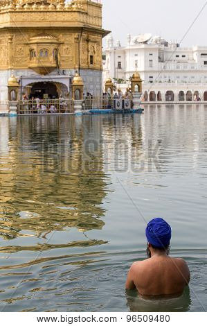 Sikh Man Visiting The Golden Temple In Amritsar, Punjab, India.