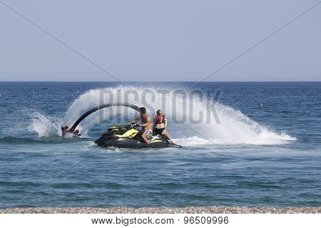 Unidentified Turkish Man Demonstrates Flyboard Acrobatics On The Beach Of Camyuva