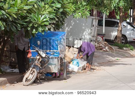 Cambodian family searching for food in the rubbish