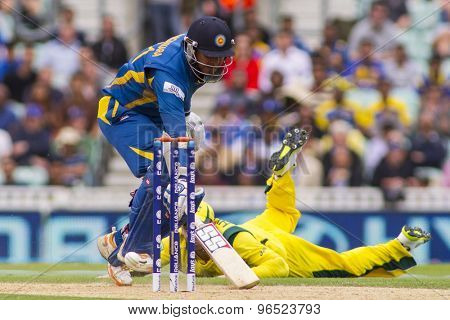 LONDON, ENGLAND - June 17 2013: Sri Lanka's Kumar Sangakkara runs a single during the ICC Champions Trophy international cricket match between Sri Lanka and Australia.