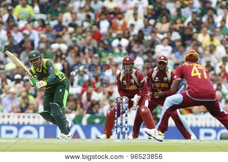 LONDON, ENGLAND - June 07 2013: Pakistan's Shoaib Malik hits the ball to Dwayne Bravo and is dismissed for a duck during the ICC Champions Trophy cricket match between Pakistan and The West Indies
