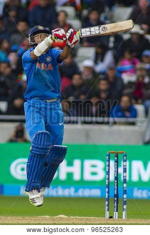 EDGBASTON, ENGLAND - June 23 2013: India's Shikhar Dhawan plays a shot during the ICC Champions Trophy final cricket match between England and India at Edgbaston Cricket Ground