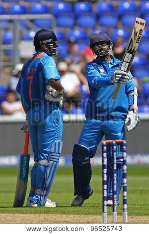 CARDIFF, WALES - June 04 2013: India's Dinesh Karthik celebrates a half century during the ICC Champions Trophy warm up match between India and Australia at the Cardiff Wales Stadium