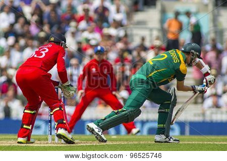 LONDON, ENGLAND - June 19 2013: England's Jos Buttler catches the ball to dismiss Chris Morris during the ICC Champions Trophy semi final between England and South Africa at The Oval Cricket Ground
