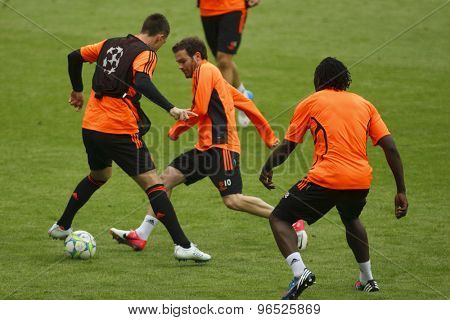 MUNICH, GERMANY May 18 2012 Chelsea's English defender John Terry  is nutmeged by Chelsea's Spanish midfielder Juan Mata during the official Chelsea training for the 2012 UEFA Champions League Final