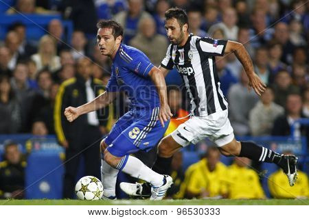 LONDON, ENGLAND. September 19 2012 Chelsea's English midfielder Frank Lampard  and Juventus's forward Mirko Vucinic during the UEFA Champions League football match between Chelsea and Juventus