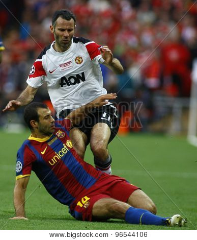 LONDON, ENGLAND. May 28 2011: Barcelona's midfielder Javier Mascherano and Manchester's midfielder Ryan Giggs during the 2011UEFA Champions League final between Manchester United and FC Barcelona