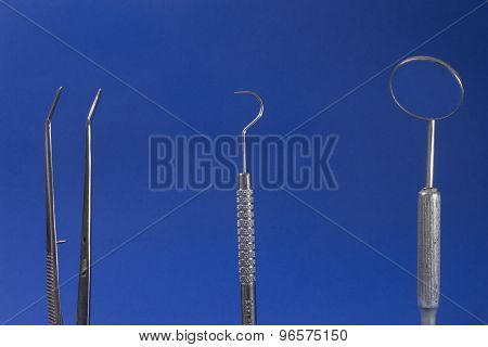 dental instrument on blue background