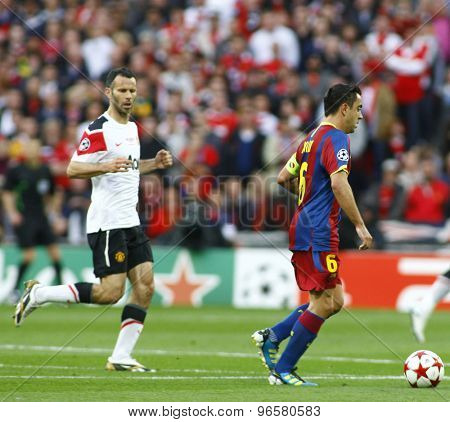 LONDON, ENGLAND. May 28 2011: Manchester's midfielder Ryan Giggs and Barcelona's midfielder Xavi Hernandez  during the 2011UEFA Champions League final between Manchester United and FC Barcelona