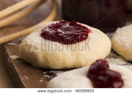 Dough With Marmelade On Wooden Board