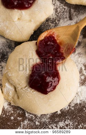Dough With Marmelade On Wooden Board