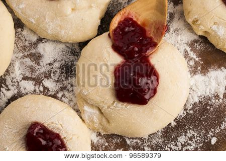Dough With Marmelade On Wooden Board