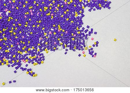 Polymeric dye. Plastic pellets. Colorant for plastics. Pigment in the granules.  Polymer beads