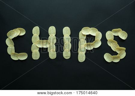 Word of food Chips on a black background