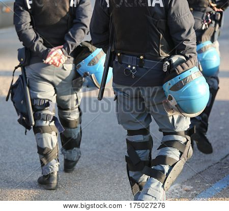 Italian Police In Riot Gear With Flak Jackets And Protective Hel