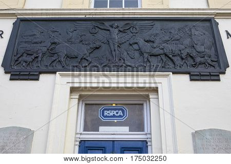LONDON UK - 16TH FEBRUARY 2017: An embossed plaque on the facade of the Animal War Memorial Dispensary in Kilburn London on 16th February 2017.