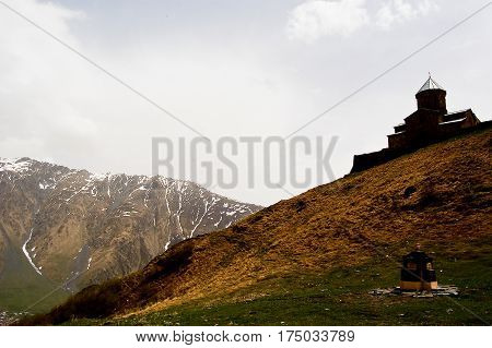 small church in the mountains of caucasus views from giorgia