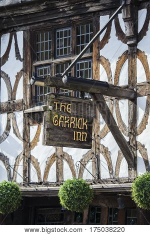 STRATFORD-UPON-AVON UK - MARCH 2ND 2017: The sign above the main entrance to the Garrick Inn Public House in Stratford-Upon-Avon on 2nd March 2017. It is reputedly the oldest pub in the town.