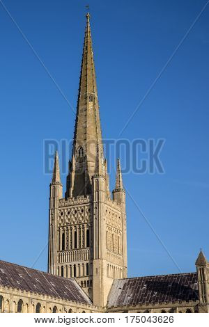 A view of the spire of the magnificent Norwich Cathedral in the historic city of Norwich UK.