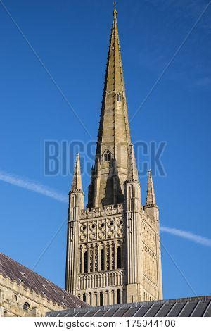 A view of the spire of the magnificent Norwich Cathedral in the historic city of Norwich UK.