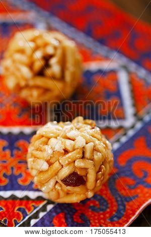 Chak-chak traditional asian sweet dessert - fried dough with honey