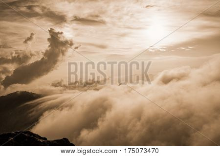 Sepia color vintage style Beautiful landscape nature of high mountain fog cloud and sky in winter from viewpoint Phu Chi Fa Forest Park at Chiang Rai Province Thailand