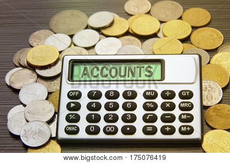 coins and silver calculator with text on display-accounts