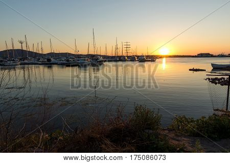 SOZOPOL, BULGARIA - JULY 11, 2016: Amazing Sunset at the port of Sozopol, Burgas Region, Bulgaria