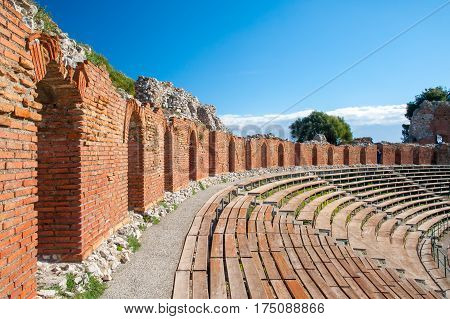 Section of the upper external arcade of the greek theater and a view of its bleachers Taormina East Sicily