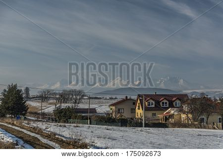 Hadusovce Village And Tatry Mountains In Sunny Winter Day