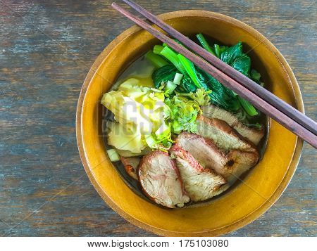 Noodles with BBQ red pork and dumpling and chinese cabbage