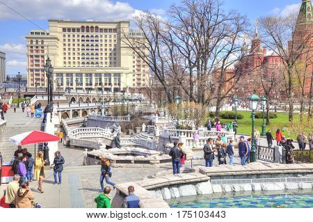 MOSCOW RUSSIA - April 24.2016: People walk past the Alexander Garden fountains in the historic center of city