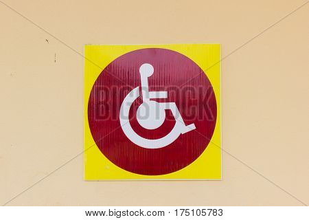 handicapped sign detail of an information signal disabled on the wall