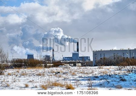 the thick smoke belching from factory chimneys