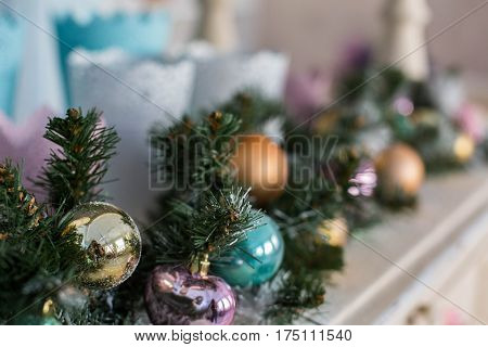 Christmas toys on a Christmas tree under snow