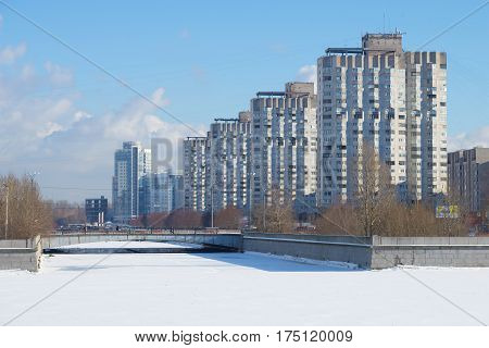 Novosmolenskaya embankment of the river Smolenka, sunny February day. Winter Saint-Petersburg
