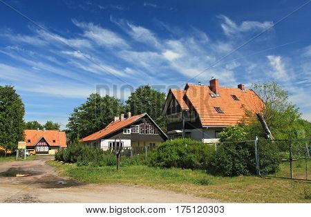 MORSKOE, KALININGRAD REGION, RUSSIA - JUNE 19, 2011: Guesthouses in the Morskoe (Pillkoppen) village in the Curonian Spit National Park. Russia.