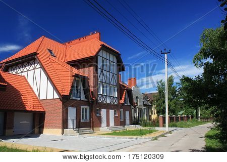 MORSKOE, KALININGRAD REGION, RUSSIA - JUNE 19, 2011: New cottages in the style of half-timbered houses in the Morskoe (Pillkoppen) village in the Curonian Spit National Park. Russia.
