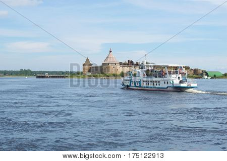SHLISSELBURG, RUSSIA - AUGUST 01, 2016: Tourist boat floats on the Neva river to the ancient russian fortress Oreshek