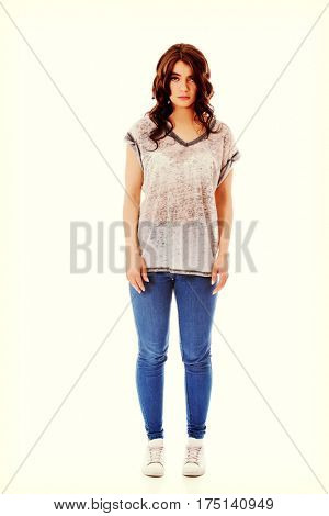 Young unhappy woman with long dark hair.