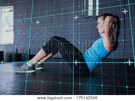 Digital composite image of fit woman performing fitness exercise in gym