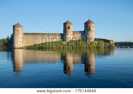 View of the medieval Olavinlinna fortress in the August evening. Savonlinna, Finland