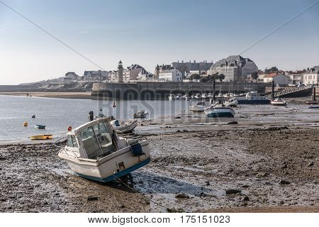 Boat at low tide in the Saint-Gilles Croix de Vie harbour (France)