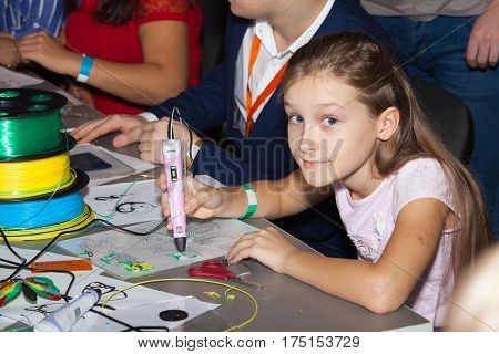 Moscow, Russia - November, 2016: Girl using 3D printing pen