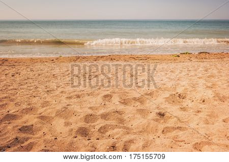 Shore of sea. Yellow sand and water. Good place for summer rest. Paradise far from civilization.