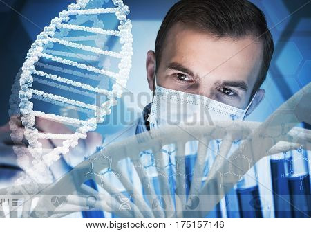 Handsome scientist making research over dna molecule structure