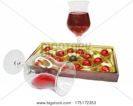 red wine in glass goblets and chocolate sweets