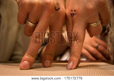 Two hands of lovers cringe at their wedding